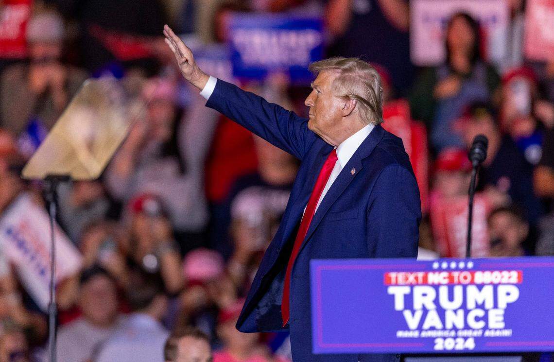 Former President Donald Trump acknowledges the crowd while leaving the stage following a rally speech at Minges Coliseum in Greenville on Monday, Oct. 21, 2024. With two weeks until Election Day, Trump went on a three-city tour, in which Trump will also see the destruction caused by Hurricane Helene in Asheville and speak at a faith conference in Concord.