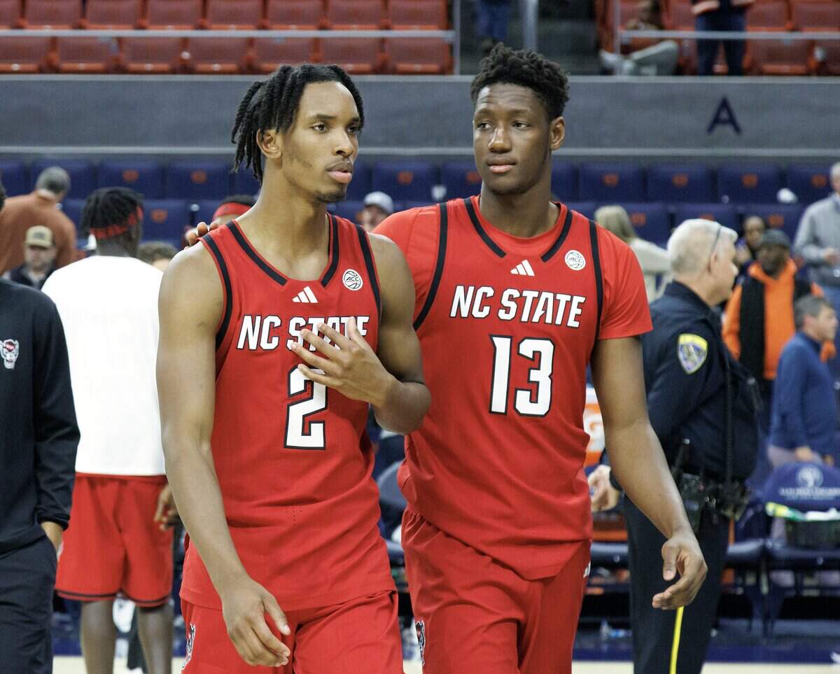 N.C. State’s Paul McNeil and Musa Sagnia walk off the court following the Wolfpack’s 83-73 loss to Auburn in the ACC/SEC Challenge on Wednesday, Dec. 3, 2025, at Neville Arena in Auburn, Ala.