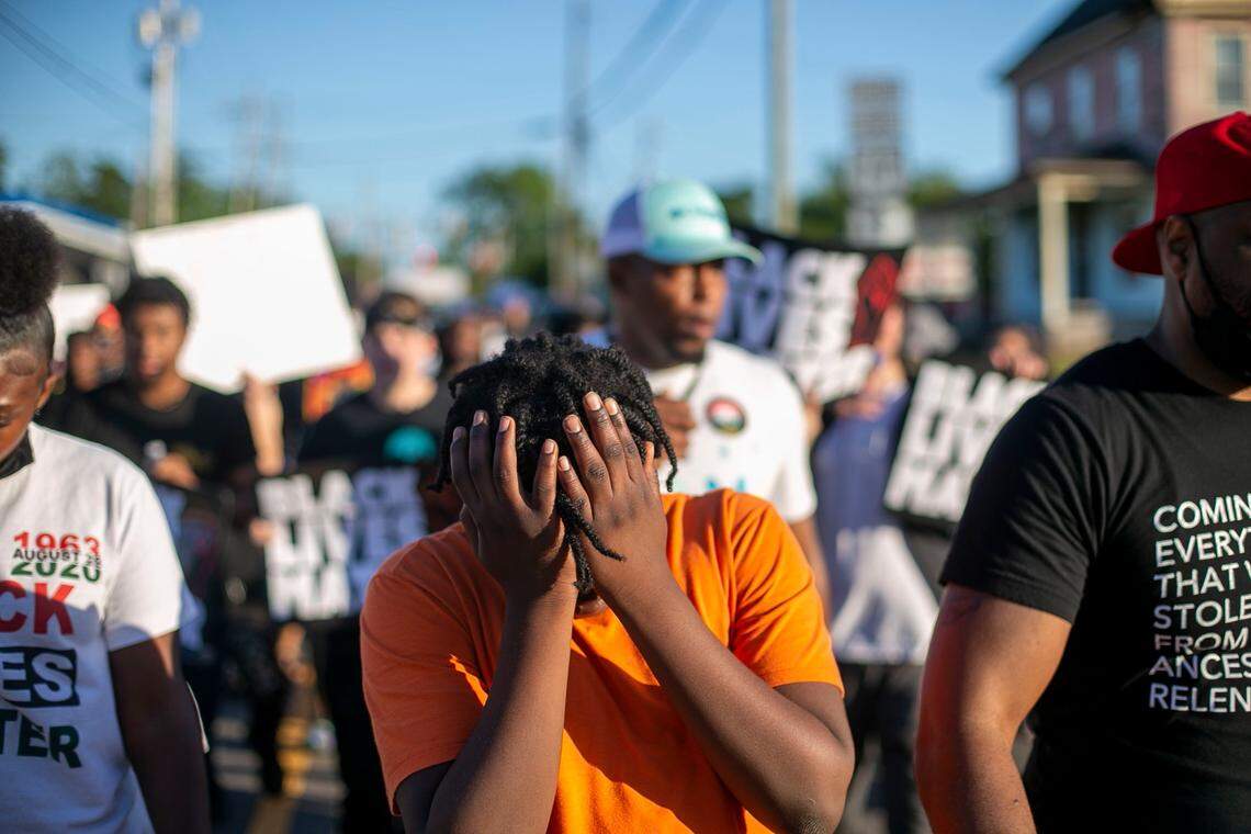 Demonstrators cross Main Street calling for justice in the Andrew Brown Jr. case on Friday, May 21, 2021 in Elizabeth City, N.C.