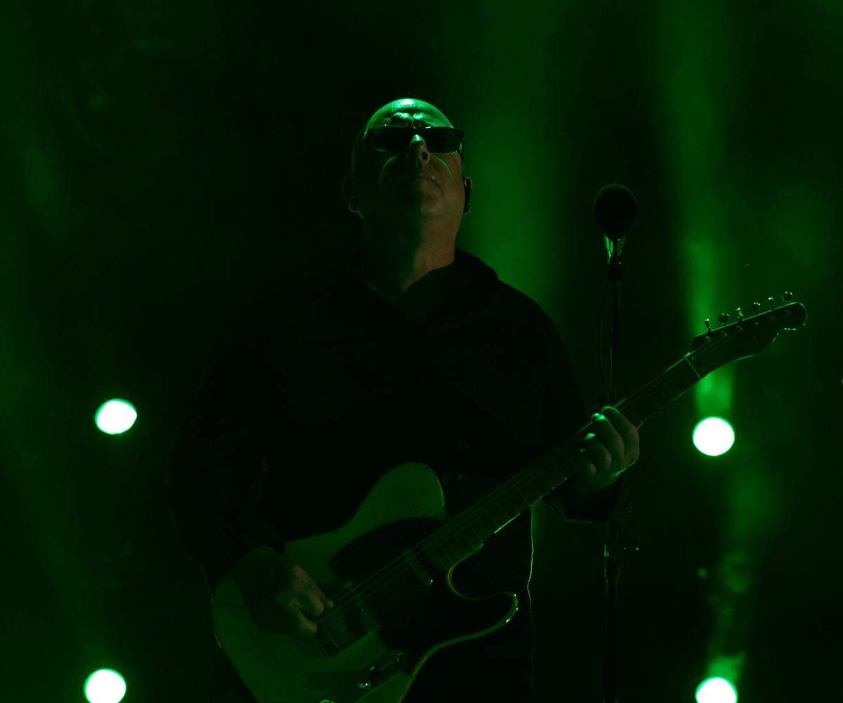 Black Francis performs as the Pixies play at Red Hat Amphitheater in Raleigh, N.C., during their North American tour on Friday, June 16, 2023.