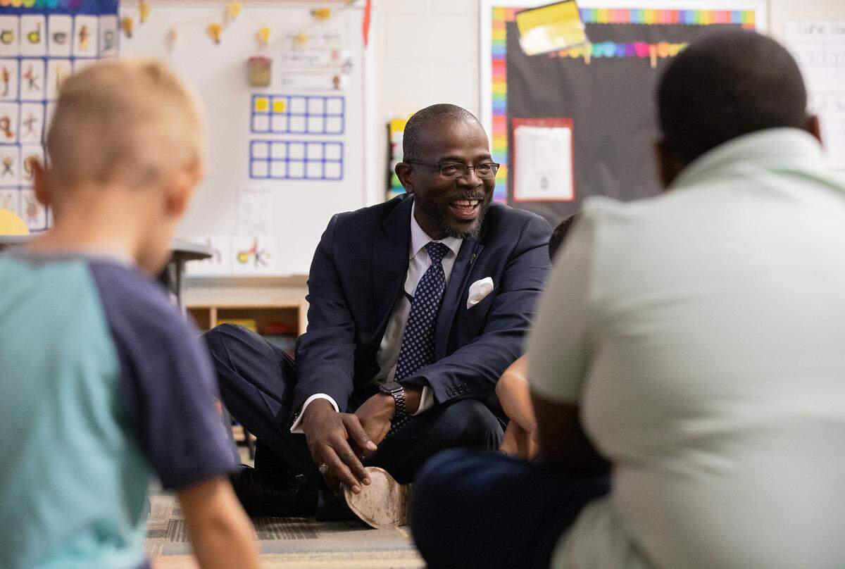 New Wake County Superintendent Robert Taylor talks with students while touring Rolesville Elementary School during his first day on the job on Monday, Oct. 2, 2023, in Rolesville, N.C.