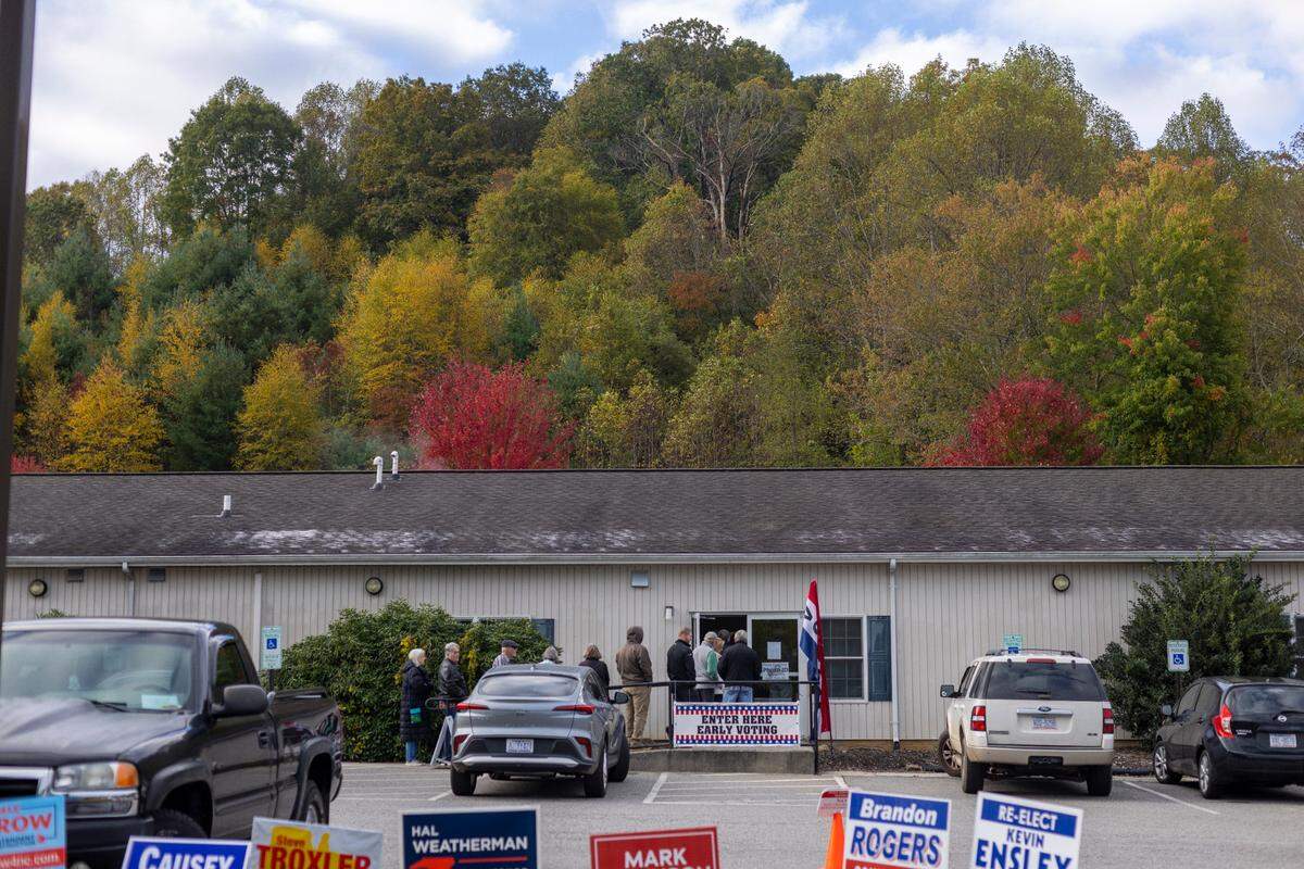 Voters wait in line to cast their ballots at the Haywood County Senior Resource Center, on the first day of early voting, in Waynesville, N.C. on Thursday, October 17, 2024.