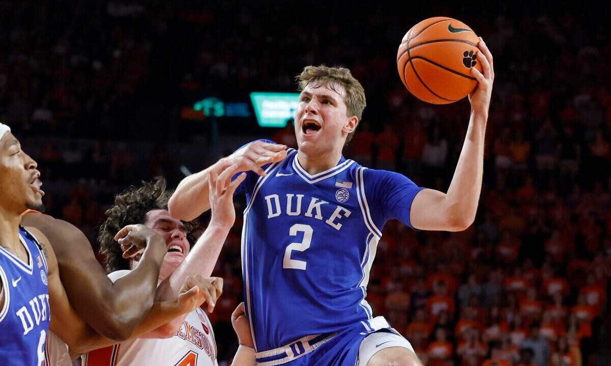 Duke’s Cooper Flagg (2) shoots as Clemson’s Ian Schieffelin (4) defends during the first half of Duke’s game against Clemson at Littlejohn Coliseum in Clemson, S.C., Saturday, Feb. 8, 2025.