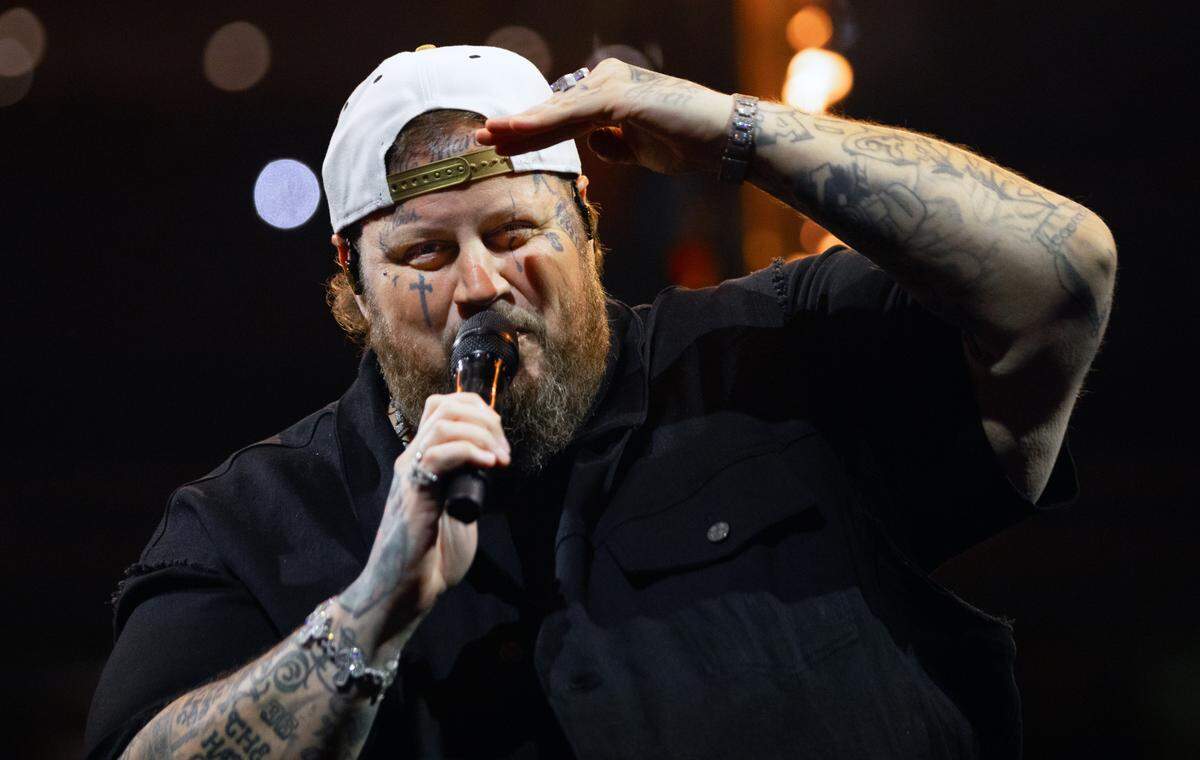 Jelly Roll salutes the crowd at Raleigh’s Lenovo Center, Friday night, Sept. 20, 2024.