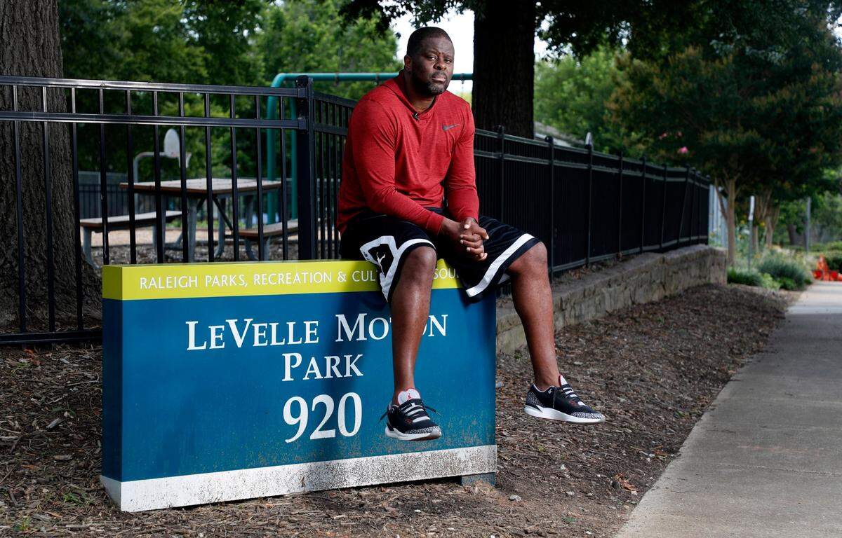 LeVelle Moton sits in the park named for him at LeVelle Moton Park in Raleigh on June 23, 2021.