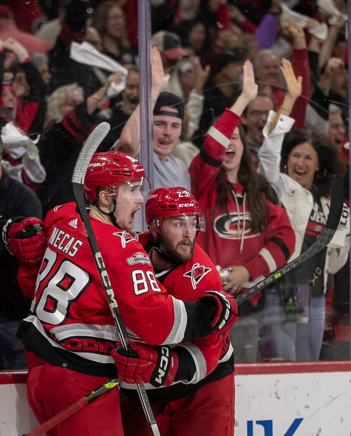 The Carolina Hurricanes Martin Necas (88) celebrates with Stefan Noesen (23) after Noesen scored on Florida Panthers goalie Sergei Bobrovsky (72) in the third period to tie the score 2-2 during Game 1 of the Eastern Conference Finals on Thursday, May 18, 2023 at PNC Arena in Raleigh, N. C.