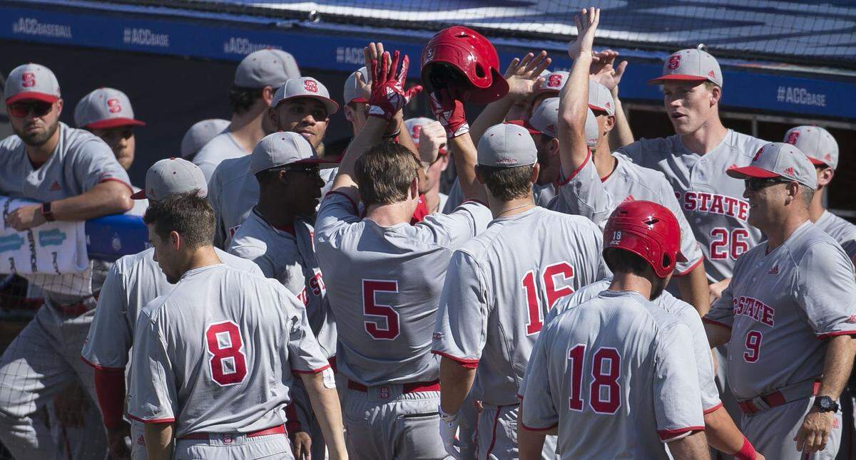 N,C. State's Patrick Bailey (5) celebrates with teammates after a solo home run in the second inning against Virginia to give the  Wolfpack a 1-0 lead during the ACC Championship on Thursday, May 24, 2018 at Durham Bulls Athletic Park in Durham, N.C.