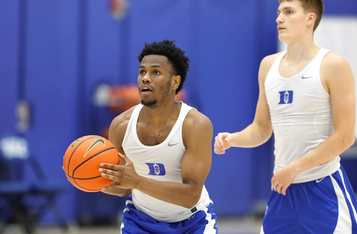Duke’s Jeremy Roach prepares to shoot during the basketball team’s workout at the K Center practice courts in Durham, N.C., Wednesday, July 12, 2023. Duke’s Jaden Schutt is to the right.