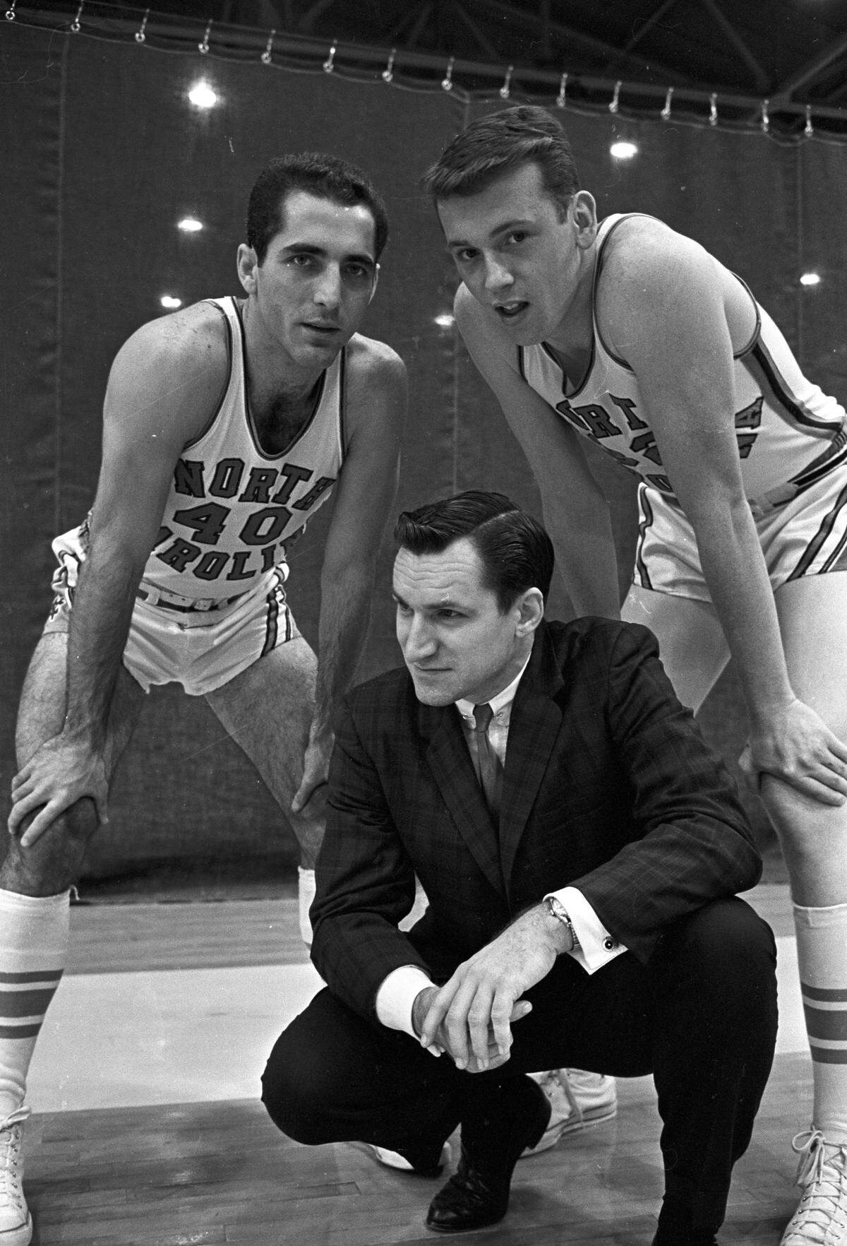 A 1962 photo of UNC head coach Dean Smith with players Yogi Poteet, left, and Billy Cunningham.
