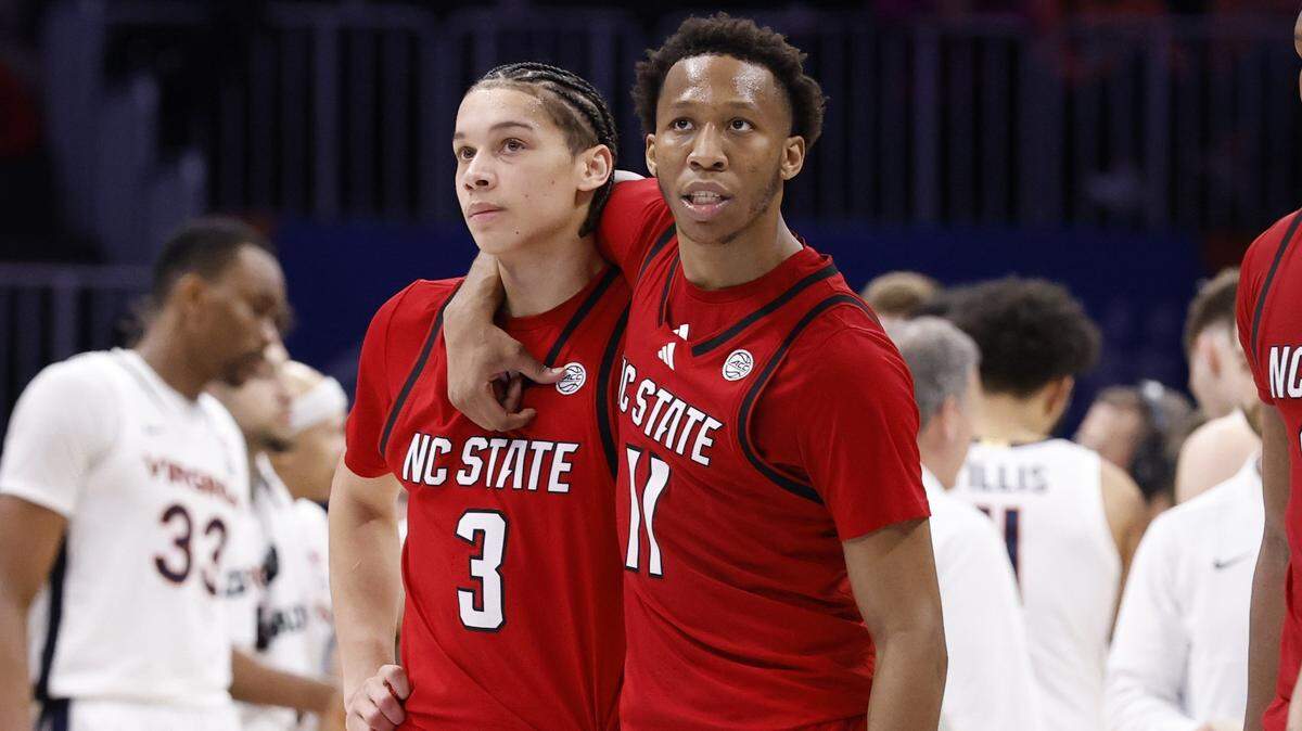 N.C. State's Quadir Copeland (11) and N.C. State's Matt Able (3) walk back to the bench after a timeout late in the second half of Virginia’s 81-74 victory over N.C. State in the quarterfinals of the 2026 ACC Men’s Basketball Tournament at the Spectrum Center in Charlotte, N.C., Thursday, March 12, 2026.