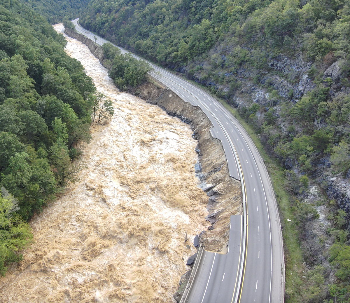 The Pigeon River damaged or destroyed the eastbound lanes of Interstate 40 in several places after the remnants of Hurricane Helene dropped historic amounts of rain on Western North Carolina. This photo was taken about four miles from the Tennessee line.