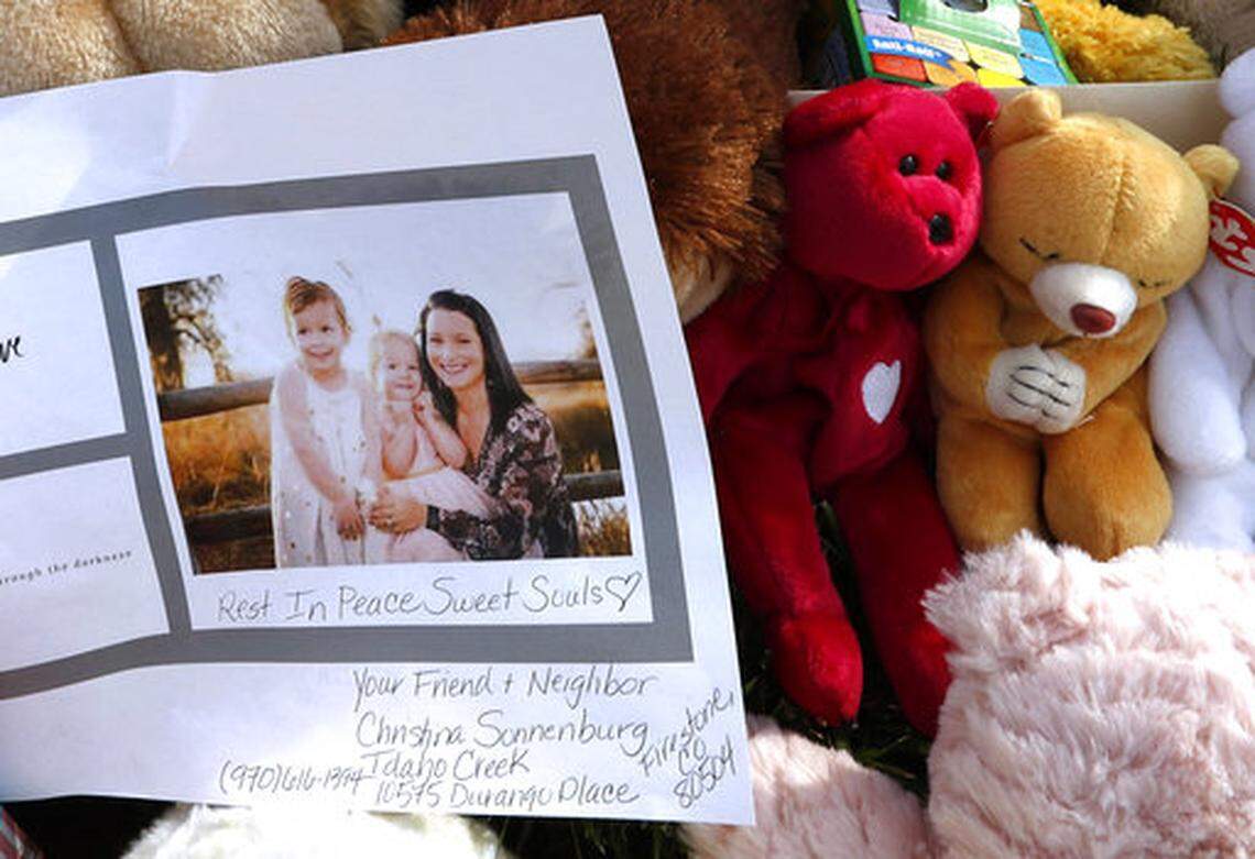 FILE - In this Aug. 16, 2018, file photo, a photograph of Shanann Watts and her daughters, Bella, 4, left, and Celeste, 3, is shown at a makeshift memorial in Frederick, Colo. Charges were filed Monday, Aug. 20, 2018, against 33-year-old Christopher Watts in the deaths of his pregnant wife and their two young daughters. (AP Photo/David Zalubowski, file)