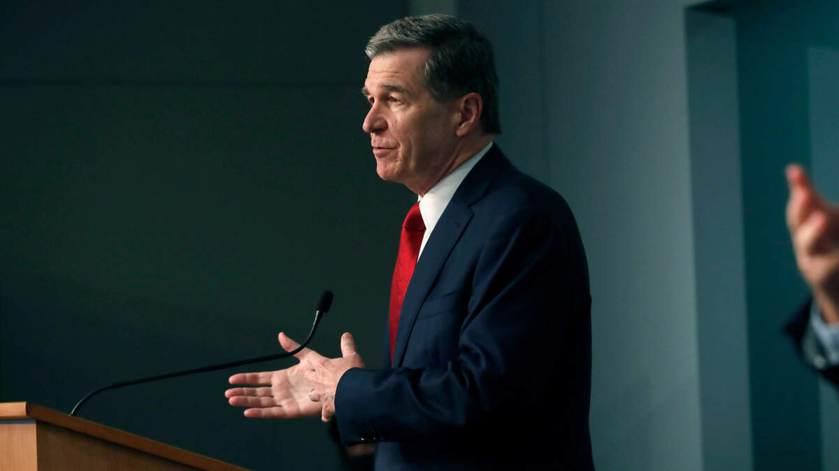 Gov. Roy Cooper speaks during a briefing at the Emergency Operations Center in Raleigh, N.C., Tuesday, July 14, 2020.