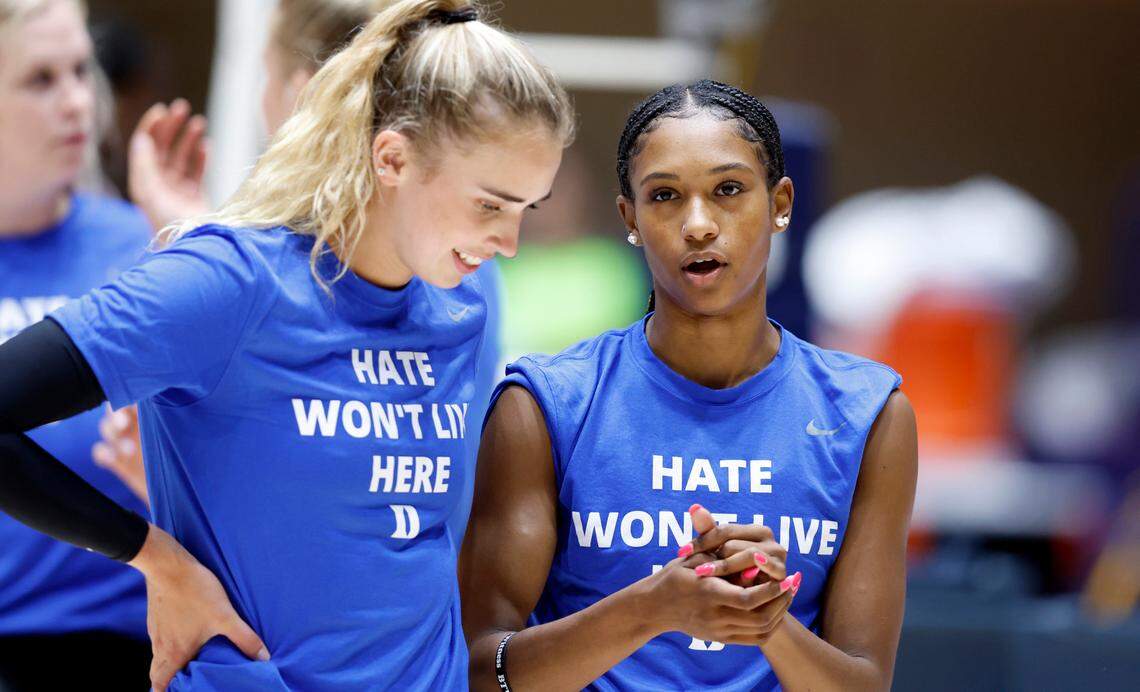 Duke’s Rachel Richardson, right, talks with Gracie Johnson during warmups before the Blue Devils’ game against East Tennessee State University in the Duke Invitational at Cameron Indoor Stadium in Durham, N.C., Friday, Sept. 2, 2022.