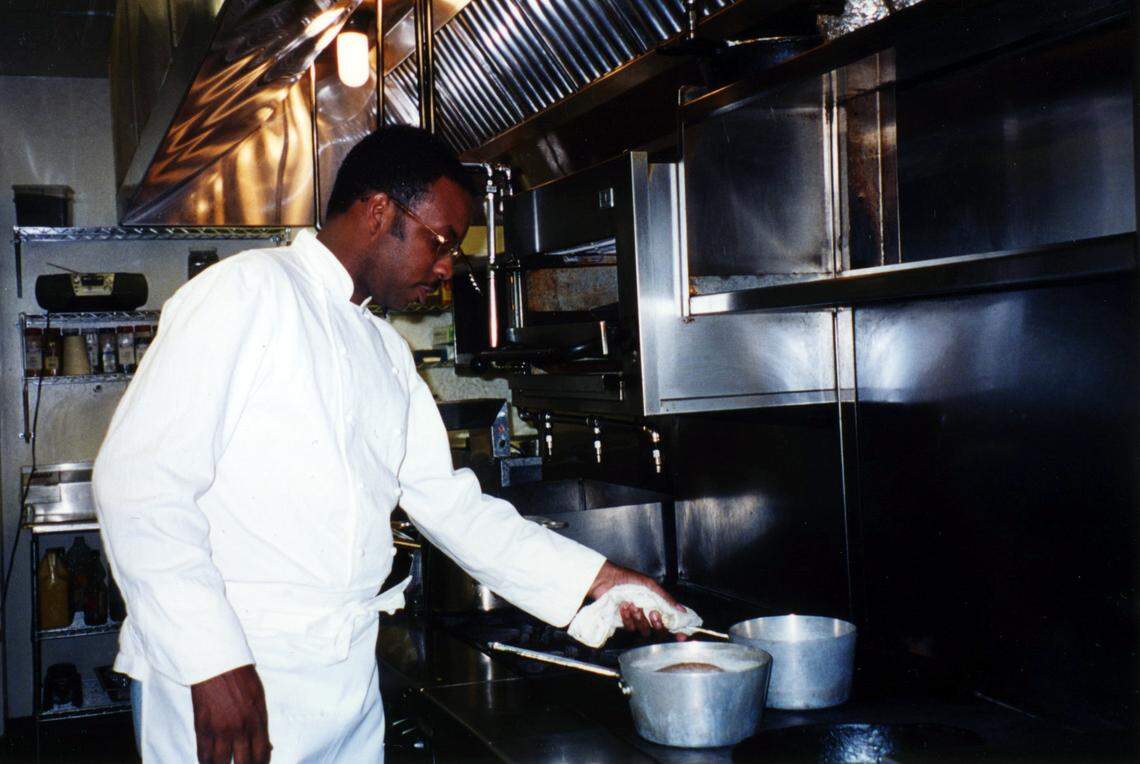 Ricky Moore works the stove during his early days as a chef.