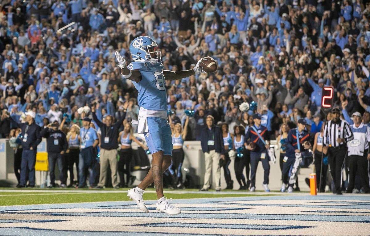 North Carolina wide receiver Kobe Paysour (8) reacts after scoring a touchdown on a one-yard pass from quarterback Drake Maye in the second quarter against Pitt on Saturday, October 29, 2022 at Kenan Stadium in Chapel Hill, N.C.