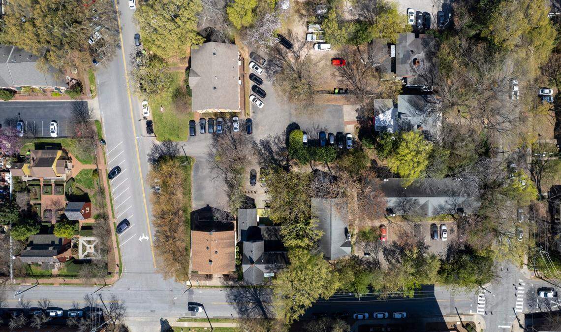 An aerial view of the historic Joel Lane Museum House on St. Mary’s Street in Raleigh, lower left, and the current site, at right, where developers have submitted a zoning request to build up to 20 stories across the street from the Joel Lane House.
