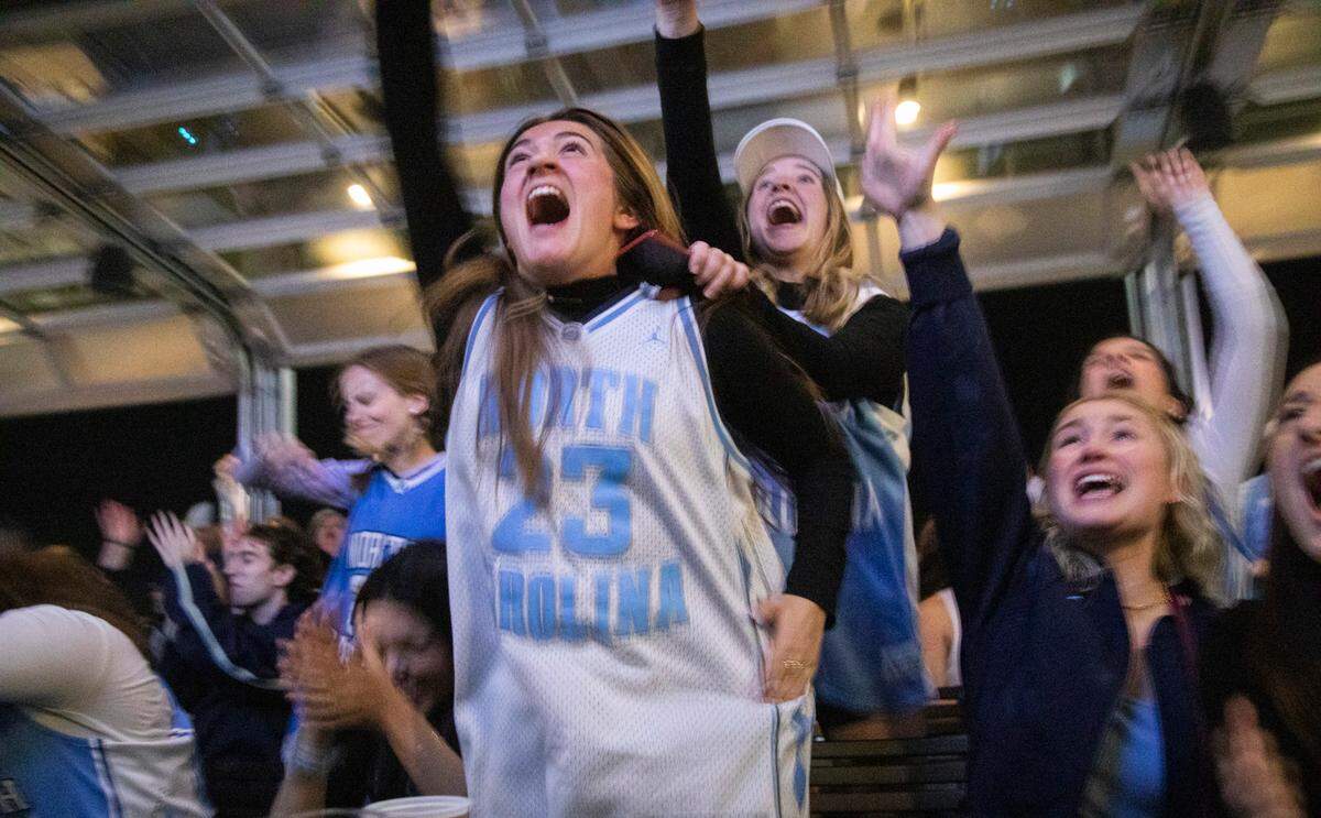 UNC basketball fans watch the NCAA Championship game against Kansas at Top of the Hill Restaurant & Brewery in Chapel Hill Monday, April 4, 2022.