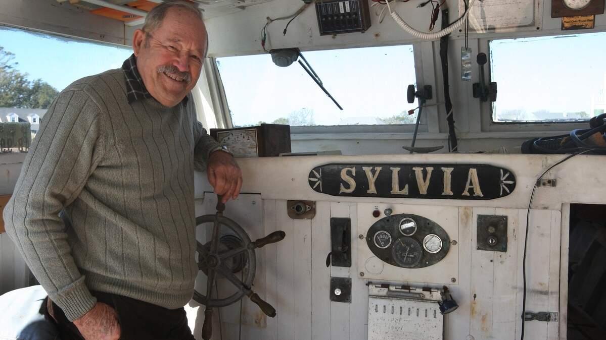Bob Simpson aboard his cherished Sylvia II, a Core Sound fishing boat he salvaged after it sunk. Simpson influenced many things in the outdoors of North Carolina. He left his mark on the Big Rock Blue Marlin Tournament, the North Carolina Maritime Museum and the Captain's Memorial on the Morehead City waterfront.