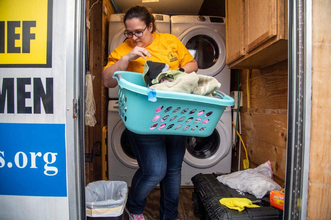 Susan Pearson with a N.C. Baptists&nbsp;on Mission&nbsp;disaster relief crew washes laundry for people effected by power outages in Moore County Tuesday, Dec. 6, 2022 at the First Baptist Church of Pinehurst . Two deliberate attacks on electrical substations in Moore County Saturday evening caused days-long power outages for tens of thousands of customers.