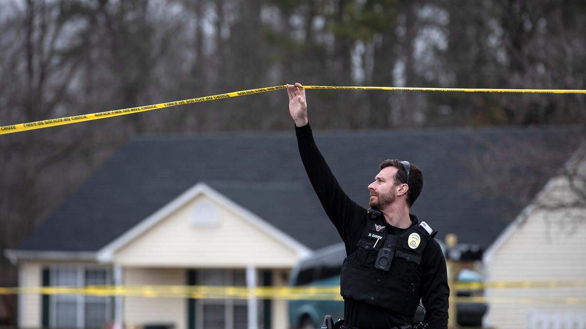 Law enforcement work the scene of a shooting on Sudbury Road in Durham, N.C. on Tuesday, Jan. 31, 2023.