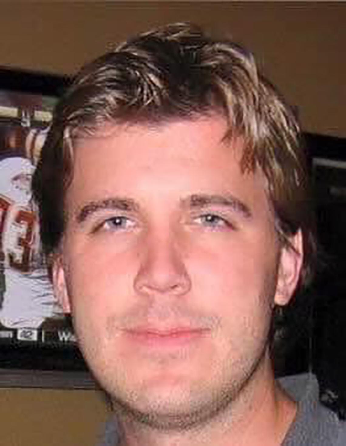 Michael John Gressman has cremated remains interred at Oakwood Cemetery in Raleigh but his mother has taken vials of his ashes around the world.