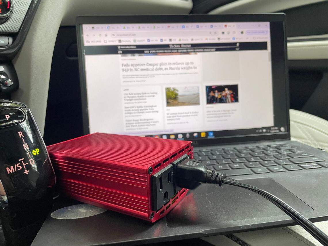 This inverter, plugged into the cigarette lighter in a car, can charge electronic devices including laptops.