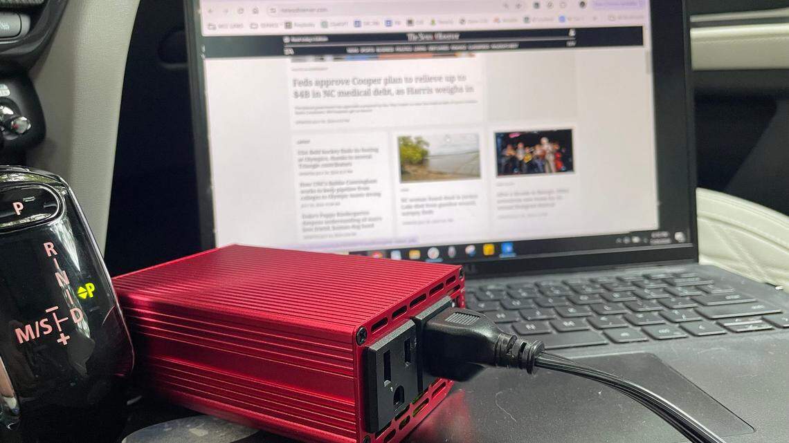 This inverter, plugged into the cigarette lighter in a car, can charge electronic devices including laptops.