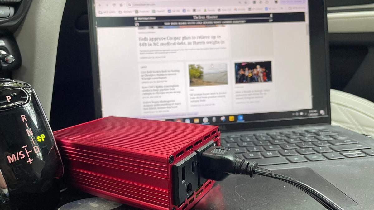 This inverter, plugged into the cigarette lighter in a car, can charge electronic devices including laptops.