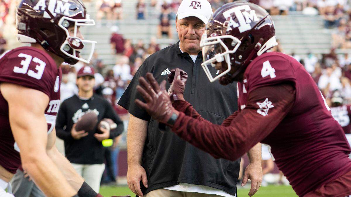 Texas A&M defensive coordinator Mike Elko watches as players drill before a game against Mississippi St. in College Station, TX. in October 2021.