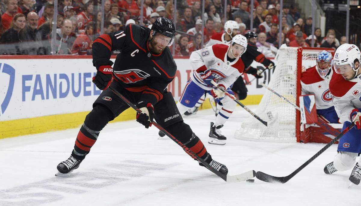 Carolina's Jordan Staal (11) keeps control of the puck during the first period of the Hurricanes’ game against the Canadiens in game one of the Eastern Conference Finals at the Lenovo Center Thursday, May, 21, 2026.