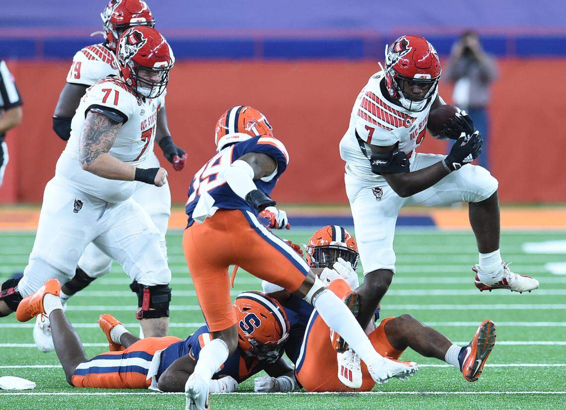 North Carolina State Wolfpack running back Zonovan Knight (7) high steps it out of a tackle during a game against Syracuse in the second half on Saturday, Nov. 28, 2020, at the Carrier Dome in Syracuse, N.Y.