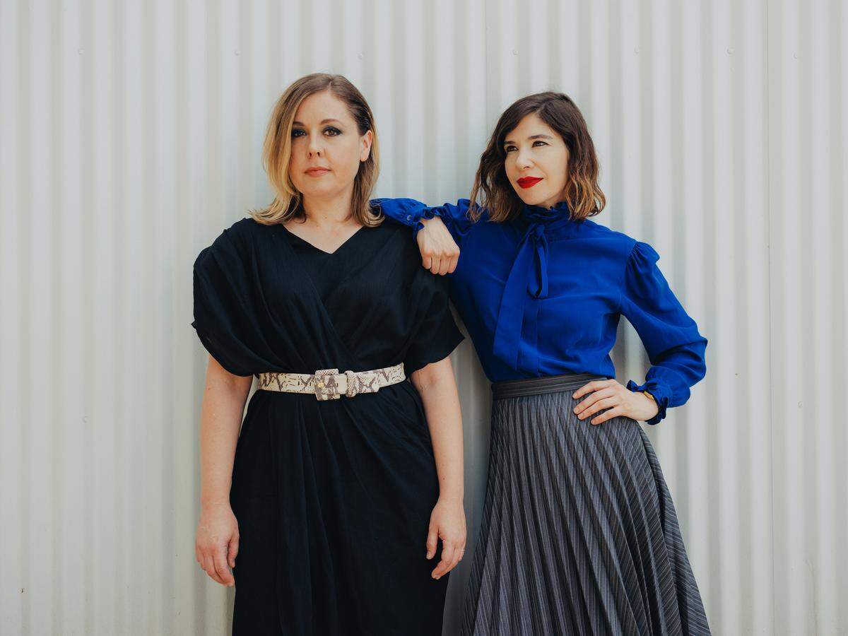Corin Tucker, left, and Carrie Brownstein of Sleater Kinney, in Los Angeles, July 9, 2019. After two and a half decades, the acclaimed band collaborates with St. Vincent for its ninth album -- and moves onward without its longtime drummer. (Rozette Rago/The New York Times)