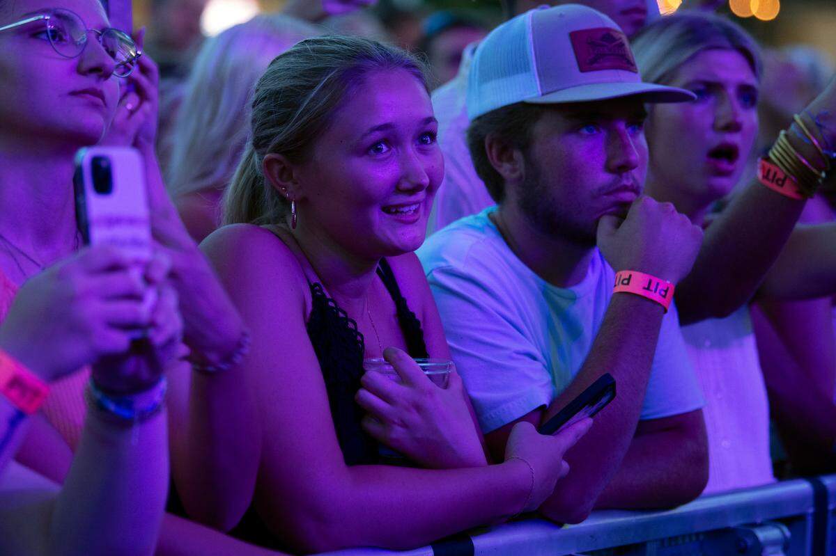 Fans along the barricade listen to Tyler Childers as he plays Raleigh, N.C.’s Red Hat Amphitheater.