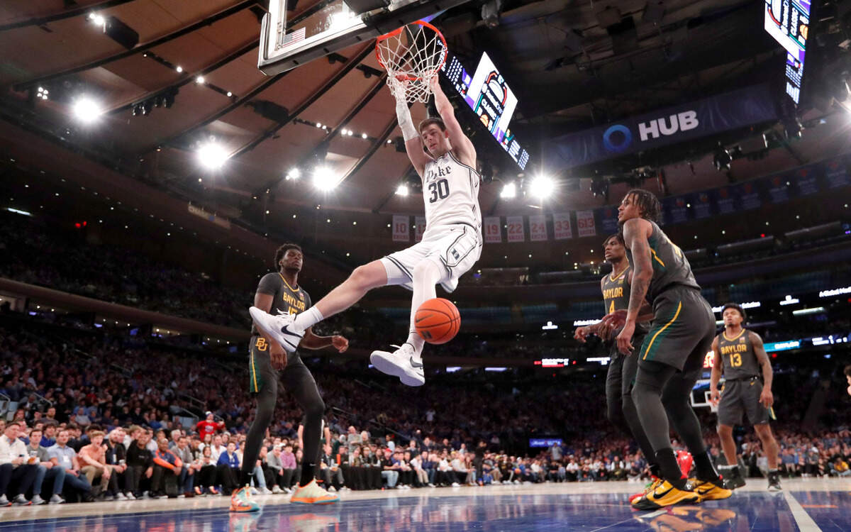 Duke’s Kyle Filipowski (30) slams in two in the second half during Duke’s 78-70 victory over Baylor at Madison Square Garden in New York City Wednesday, Dec. 20, 2023.