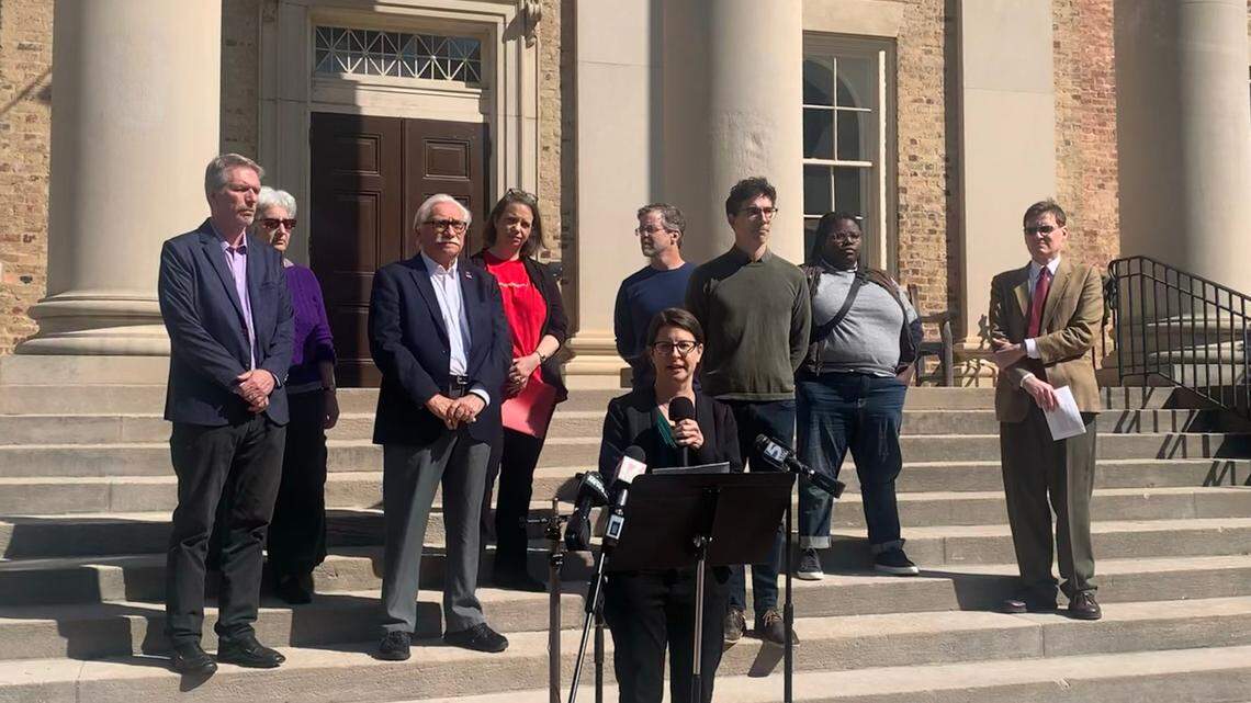 UNC Charlotte professor and AAUP leader Nicole Peterson speaks at a press conference highlighting issues of academic freedom and racism at UNC System universities.