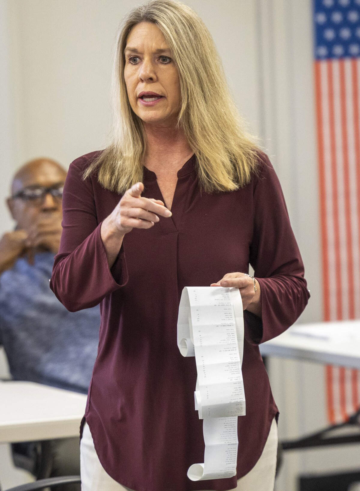 Paula Seamster, elections director for the Rockingham County Board of Elections, center, confirms the final tally after a bipartisan team hand-counted a sample of ballots Tuesday, March 24, 2026, at the board office in Reidsville in the Republican primary between Senate leader Phil Berger and Rockingham County Sheriff Sam Page. A full machine recount last week showed no change in the results, with Page leading Berger by 23 votes. To trigger a full hand recount, the partial hand count must show a net gain of two votes for Berger. The final count of the sample in Rockingham County showed no change.