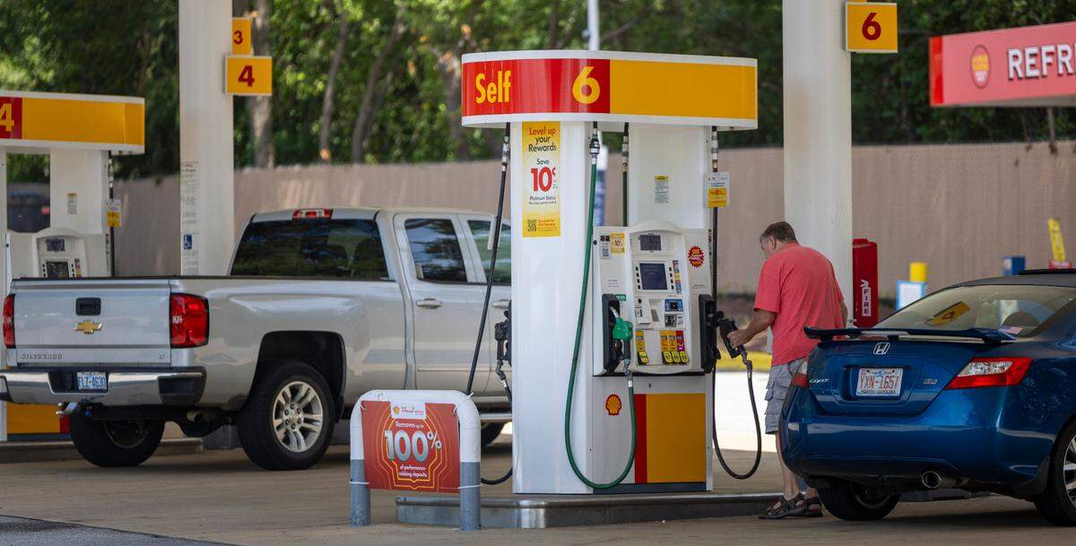 A customer fuels up at the Shell station on South Saunders Street in Raleigh on Wednesday, Sept. 11, 2024. Gasoline has dropped below $3 a gallon at several outlets in Raleigh.