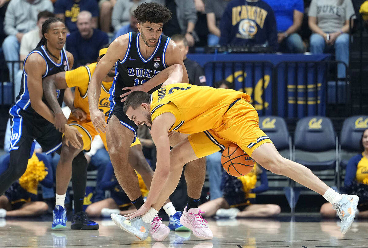 John Camden (2) of the California Golden Bears loses control of the ball while being guarded by Duke’s Cameron Boozer (12) in the first half at Haas Pavilion on January 14, 2026 in Berkeley, California.