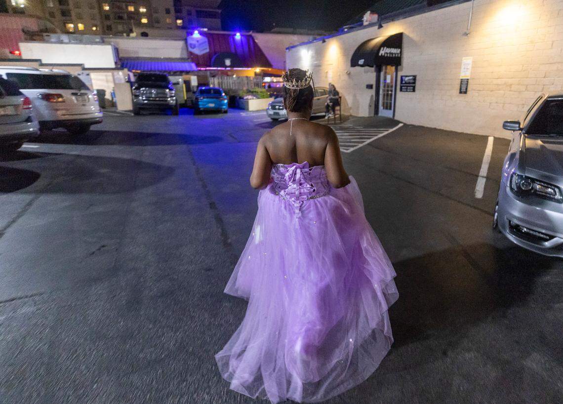 Nicole McRae of Raleigh, sports a purple chiffon gown as she makes her way to Havana Deluxe at 437 Glenwood Avenue to celebrate her birthday on Friday July 21, 2023 in Raleigh, N.C.