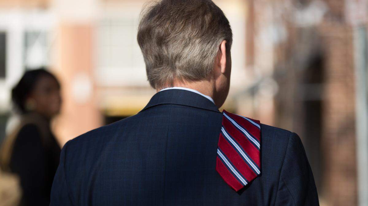 State Rep. Duane Hall waits outside of Market Hall prior to former president Bill Clinton's arrival for a Hillary Clinton for North Carolina campaign event Monday, March 7, 2016 in Raleigh, N.C. 