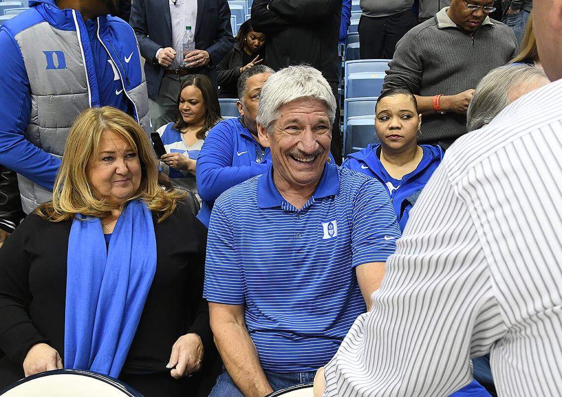 Sherry and William Allen, parents of Duke senior Grayson Allen laugh as they speak with Duke's Jose Fonseca, assistant athletic trainer before the UNC game on Feb. 8.