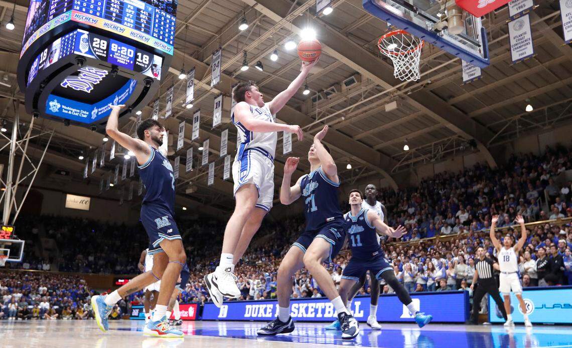 Duke’s Kon Knueppel (7) heads to the basket past Maine’s Novak Perovic (31) during Duke’s 96-62 victory over Maine at Cameron Indoor Stadium in Durham, N.C., Monday, Nov. 4, 2024. 