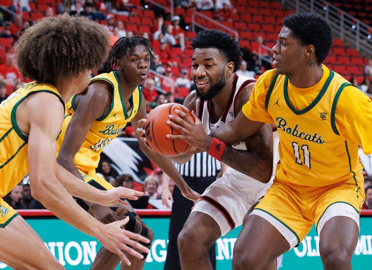 N.C. State’s Dontrez Styles is fouled as he drives through the Lees-McRae defense during the first half of the Wolfpack’s 79-75 exhibition win on Wednesday, Oct. 30, 2024, at the Lenovo Center.
