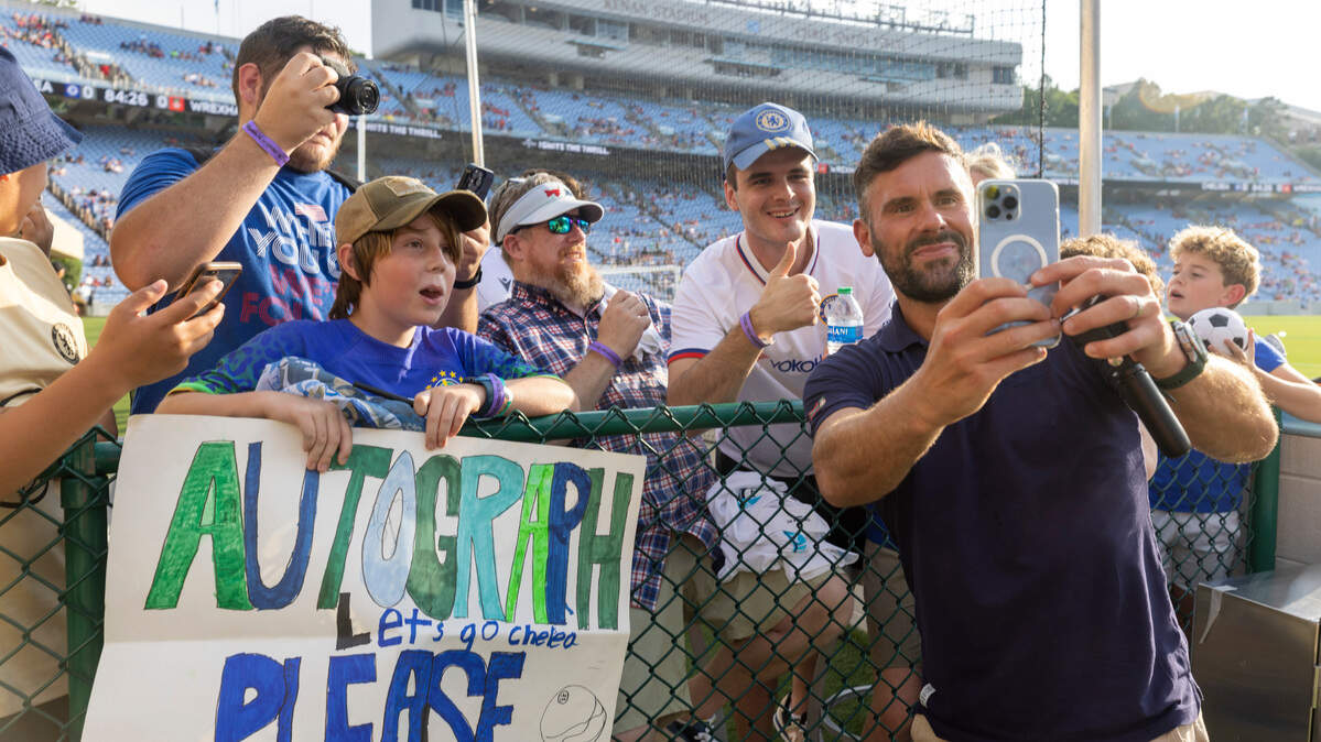 Wrexham goalkeeper Ben Foster take selfies and signs autographs for fans prior to their match against Chelsea on Wednesday, July 19, 2023 in Kenan Stadium in Chapel Hill, N.C.