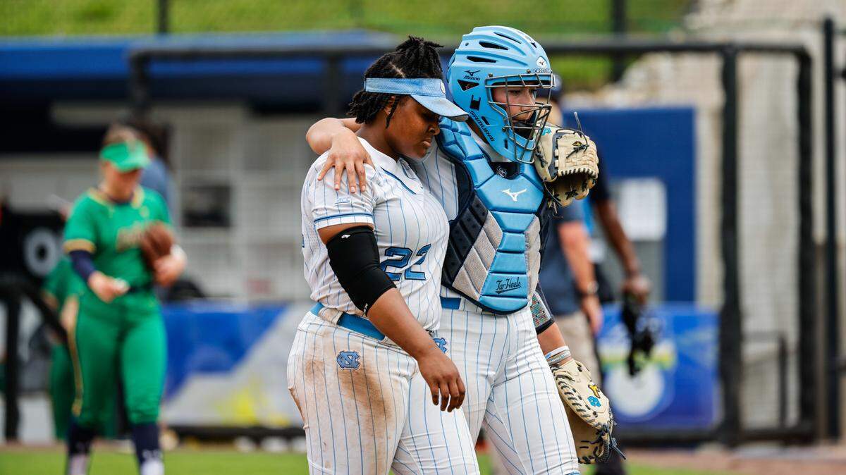 University of North Carolina pitcher Kenna Raye Dark is consoled by catcher Isabela Emerling during the Tar Heels’ 7-4 loss to Notre Dame at the 2024 ACC Softball Championship in Durham, N.C. Wednesday May 8th, 2024