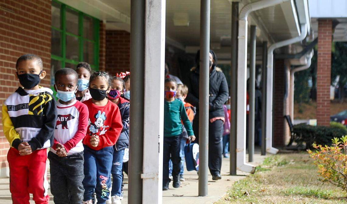 Students change classrooms at Mariam Boyd Elementary in Warrenton Tuesday, Dec. 7, 2021. Rural North Carolina school systems like Warren County Public Schools have been waiting since the start of the Leandro court case in 1994 to get the funding needed to level the playing field with urban districts.