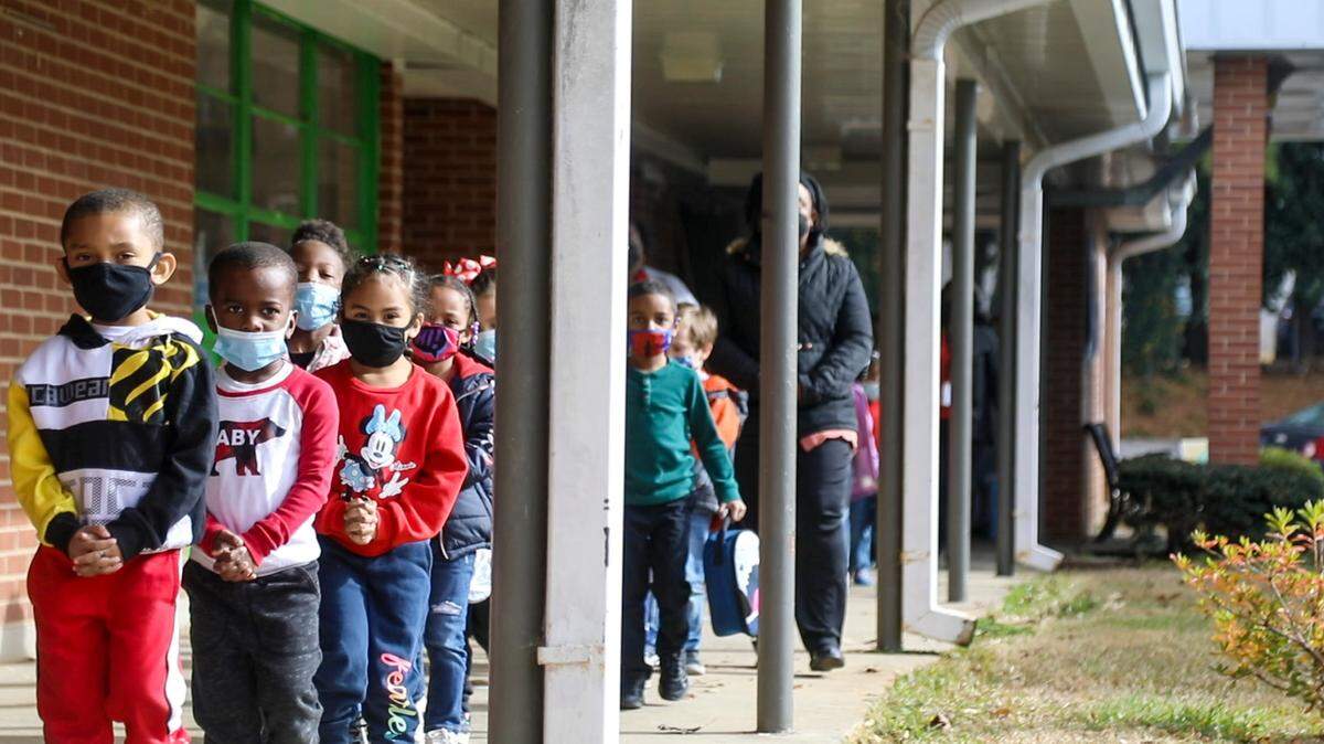 Students change classrooms at Mariam Boyd Elementary in Warrenton on Dec. 7, 2021. The school opened in 1957 and needs renovation. In 2019, the Warren County school board closed another elementary school due to concerns the aging heating system could fail.