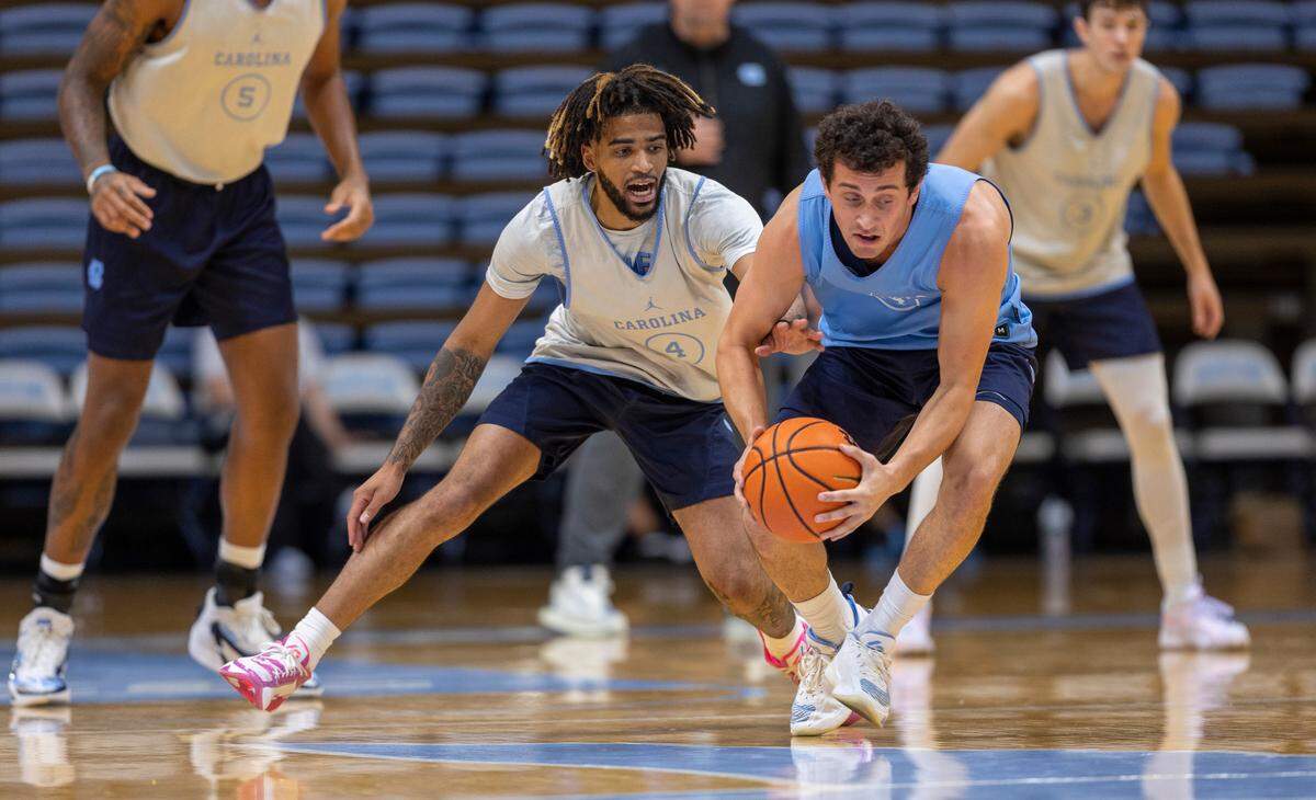 North Carolina’s R.J. Davis (4) tries for a steal from Creighton Lebo (14) during the Tar Heels’ practice on Friday, October 6, 2023 at the Dean Smith Center in Chapel Hill, N.C.