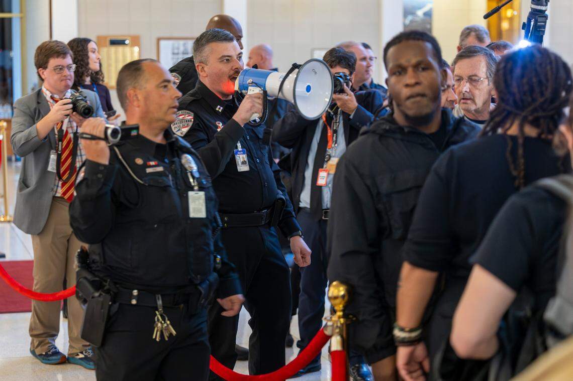 General Assembly police remove demonstrators from the North Carolina Legislative Building after the House voted to override Gov. Roy Cooper’s veto of a Helene relief bill that reduces the power of incoming Democrats in the executive branch during a session on Wednesday, Dec. 11, 2024. Cooper vetoed Senate Bill 382 on Nov. 26, calling it “a sham” and criticizing it for lacking hurricane relief and including various power grabs.